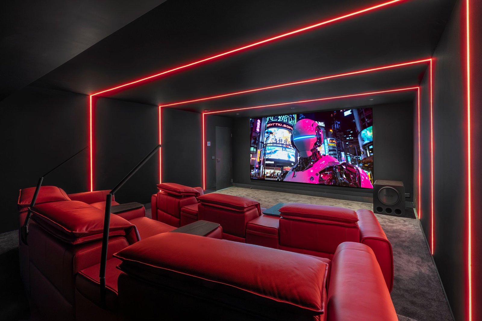 Dedicated home cinema room with tiered recliner seating